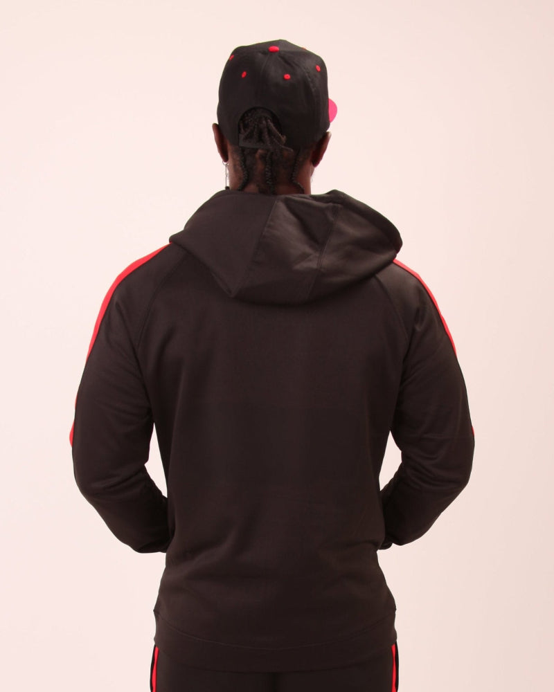 Stylish and practical, the UNIFY men's red zippered hoodie displayed against an urban backdrop.