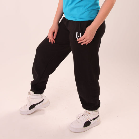 Laid-back luxury with UNIFY women's relaxed black joggers, highlighting comfort and style.