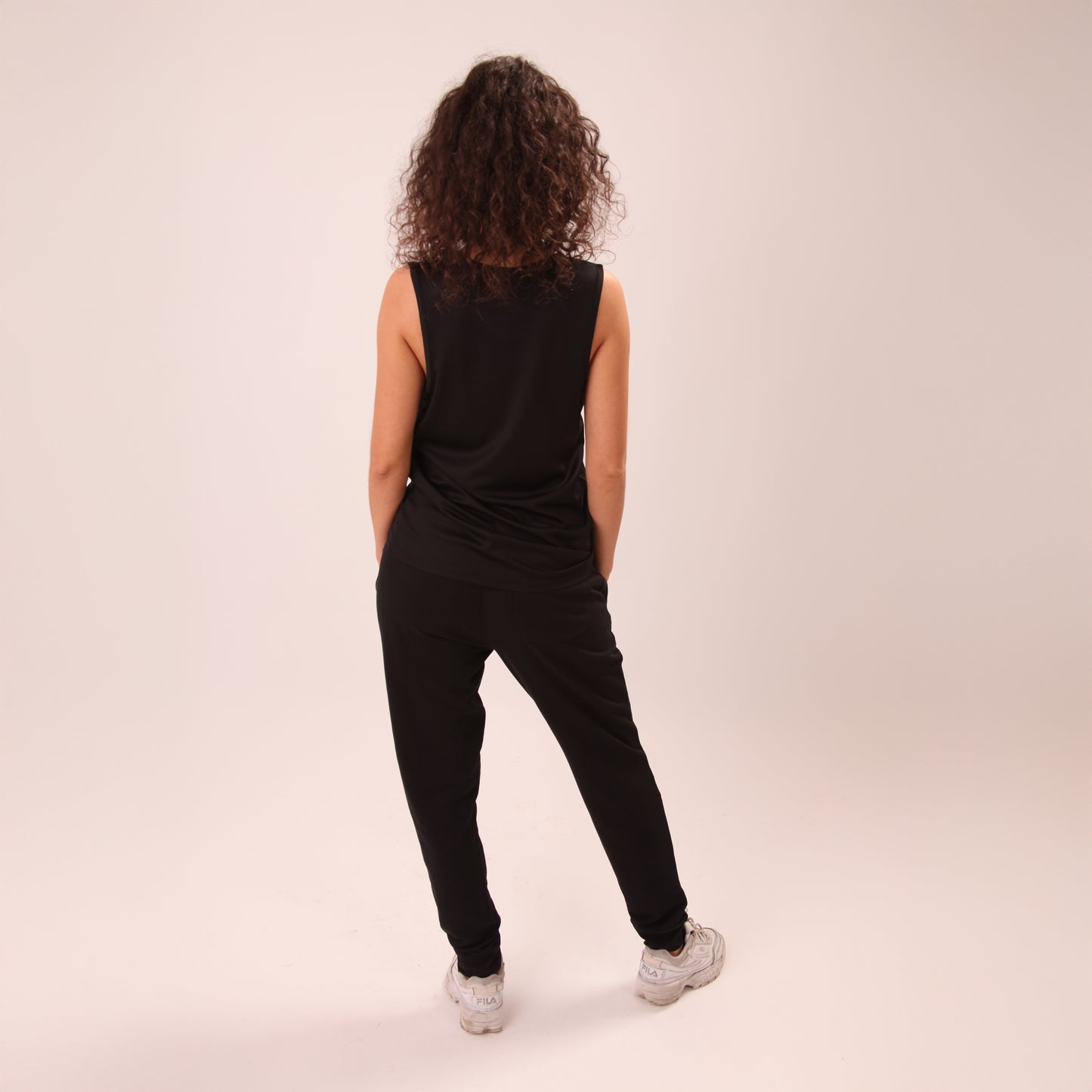 Close-up of UNIFY women's joggers showcasing soft fabric and elastic waistband.