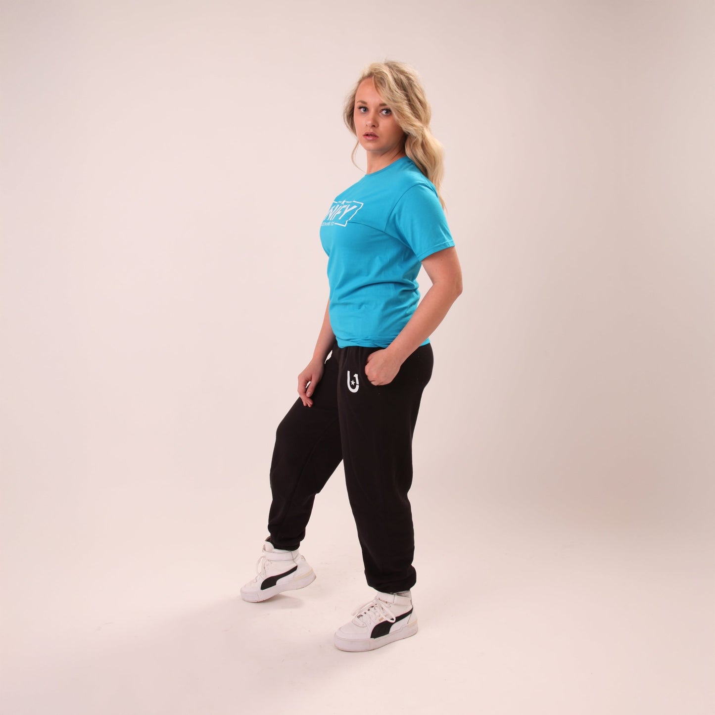 Close-up of UNIFY's black relaxed fit joggers for women, showcasing soft material and casual elegance.