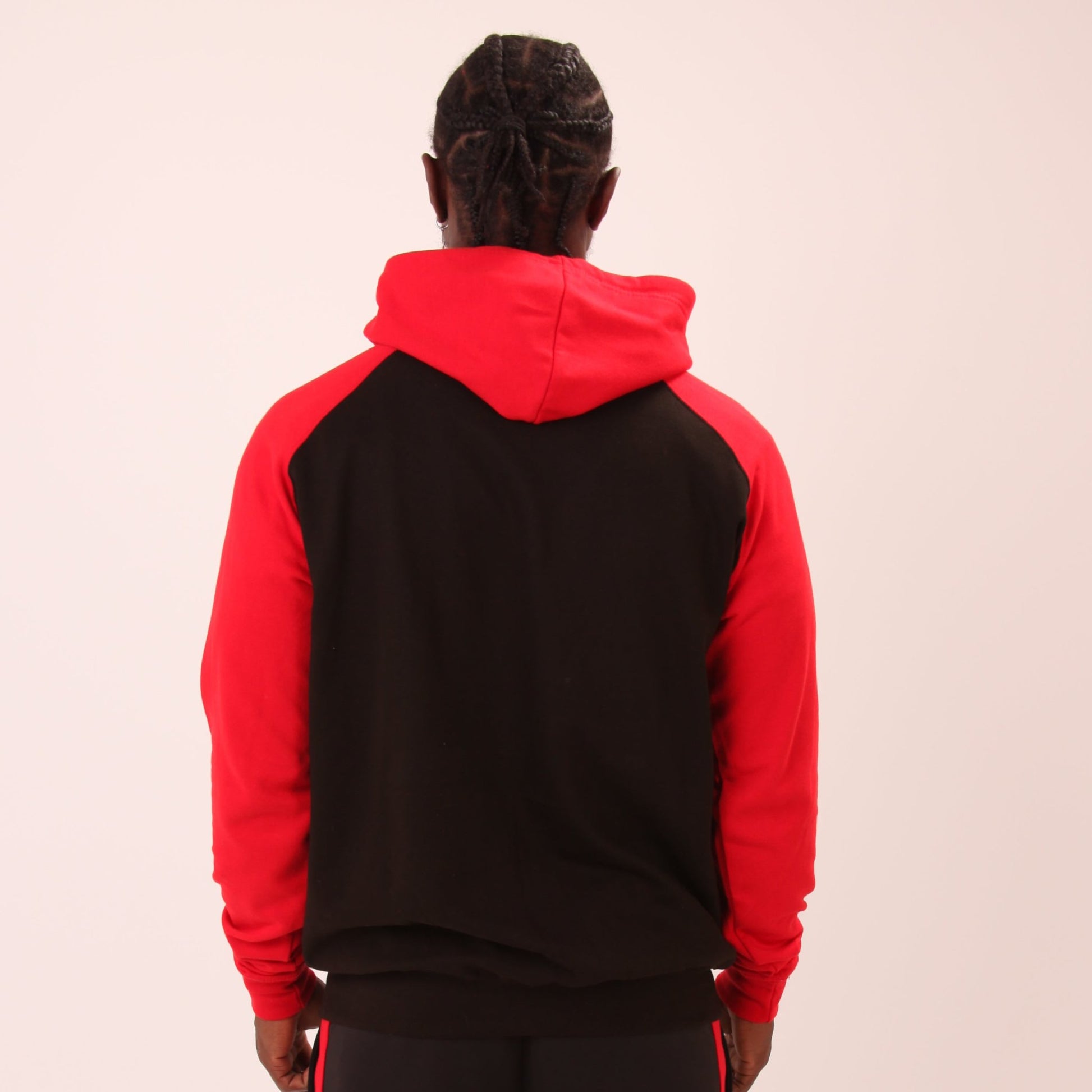 "UNIFY Essential Red/Black Hoodie displayed, highlighting its stylish fit and durable blend of cotton and polyester."