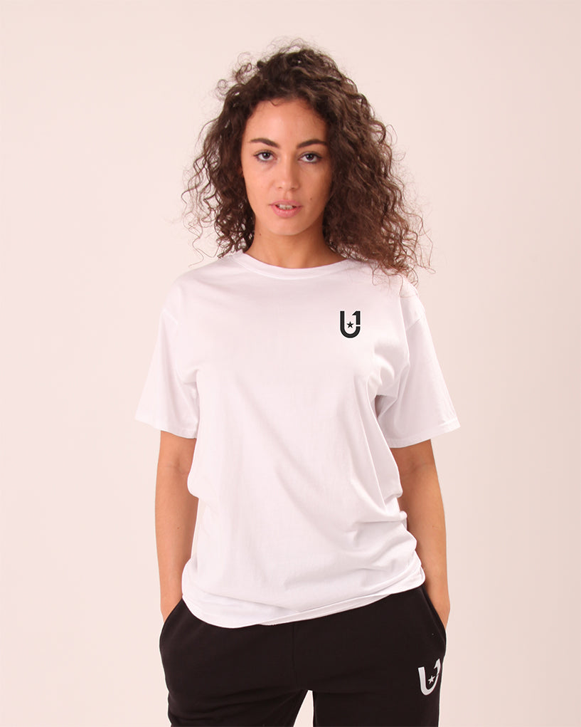 side view of UNIFY classic white tee for women styled with black joggers