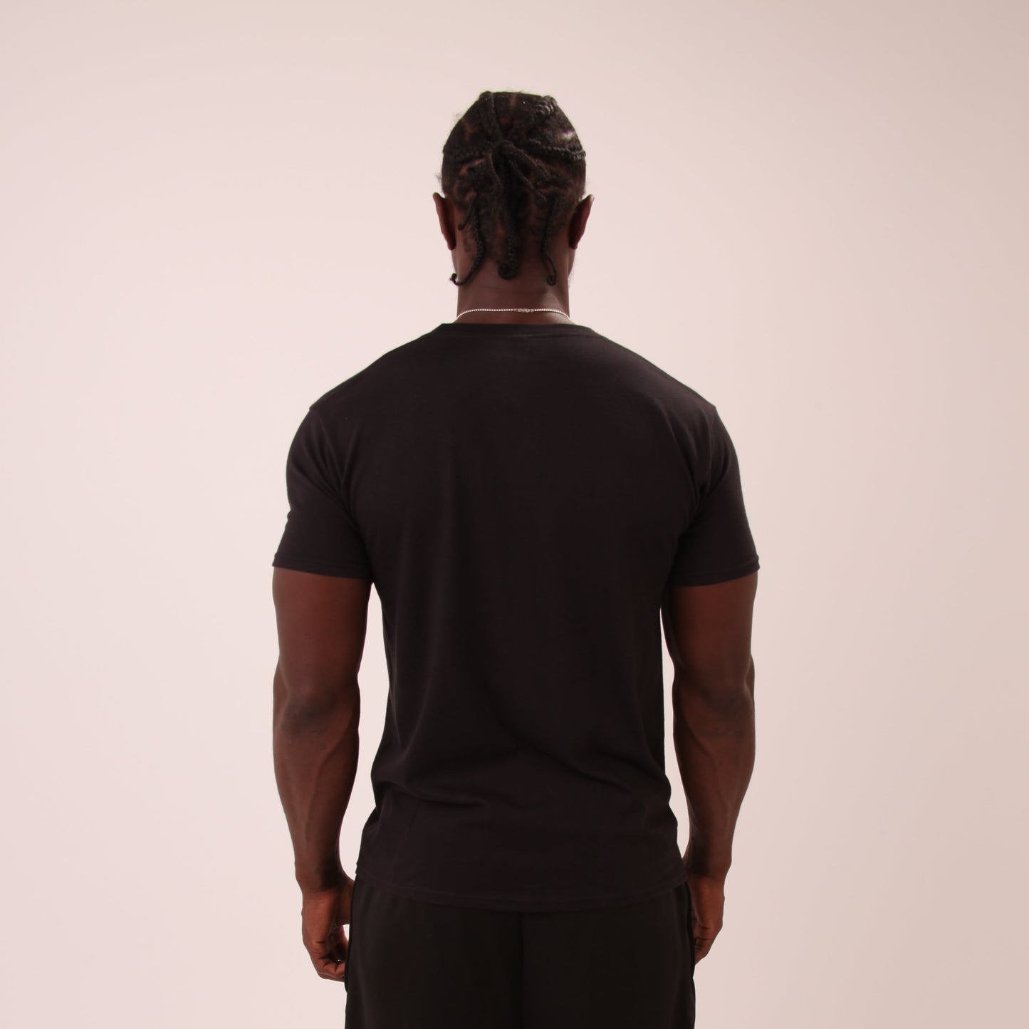 UNIFY men's black t-shirt paired with joggers for a modern streetwear look