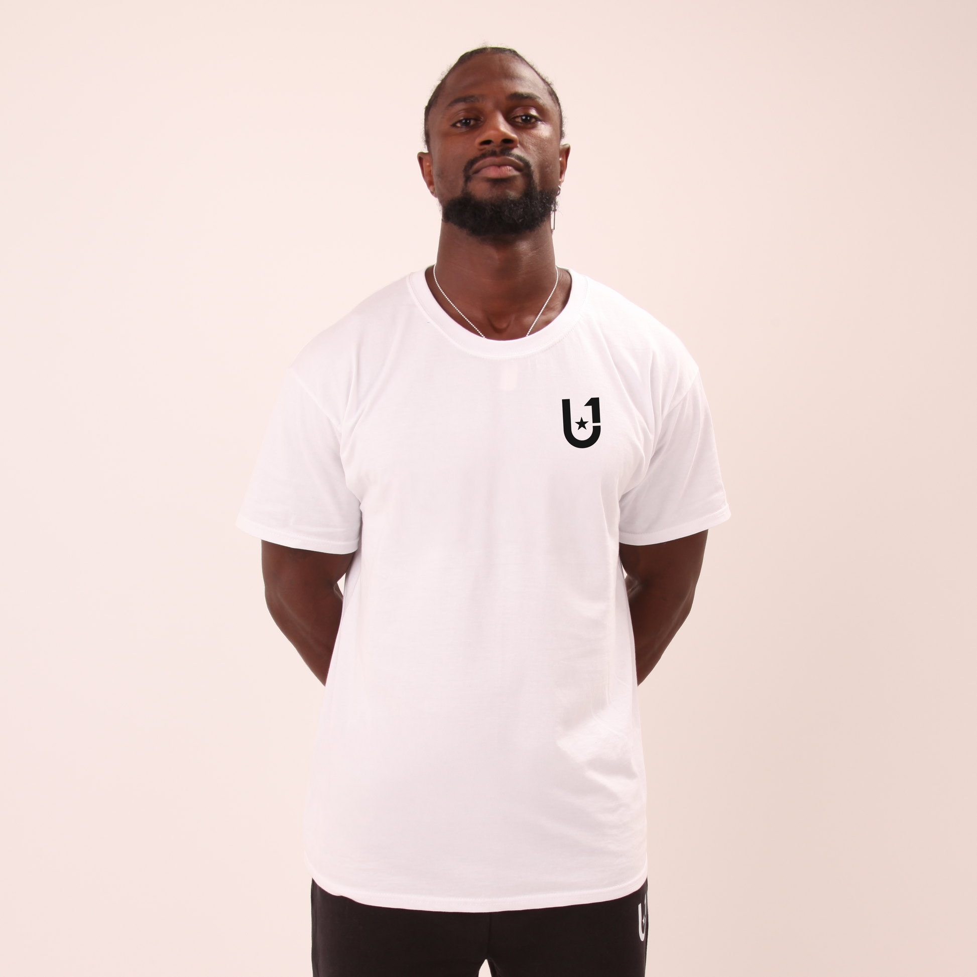 front view of UNIFY men's white tee styled for everyday wear