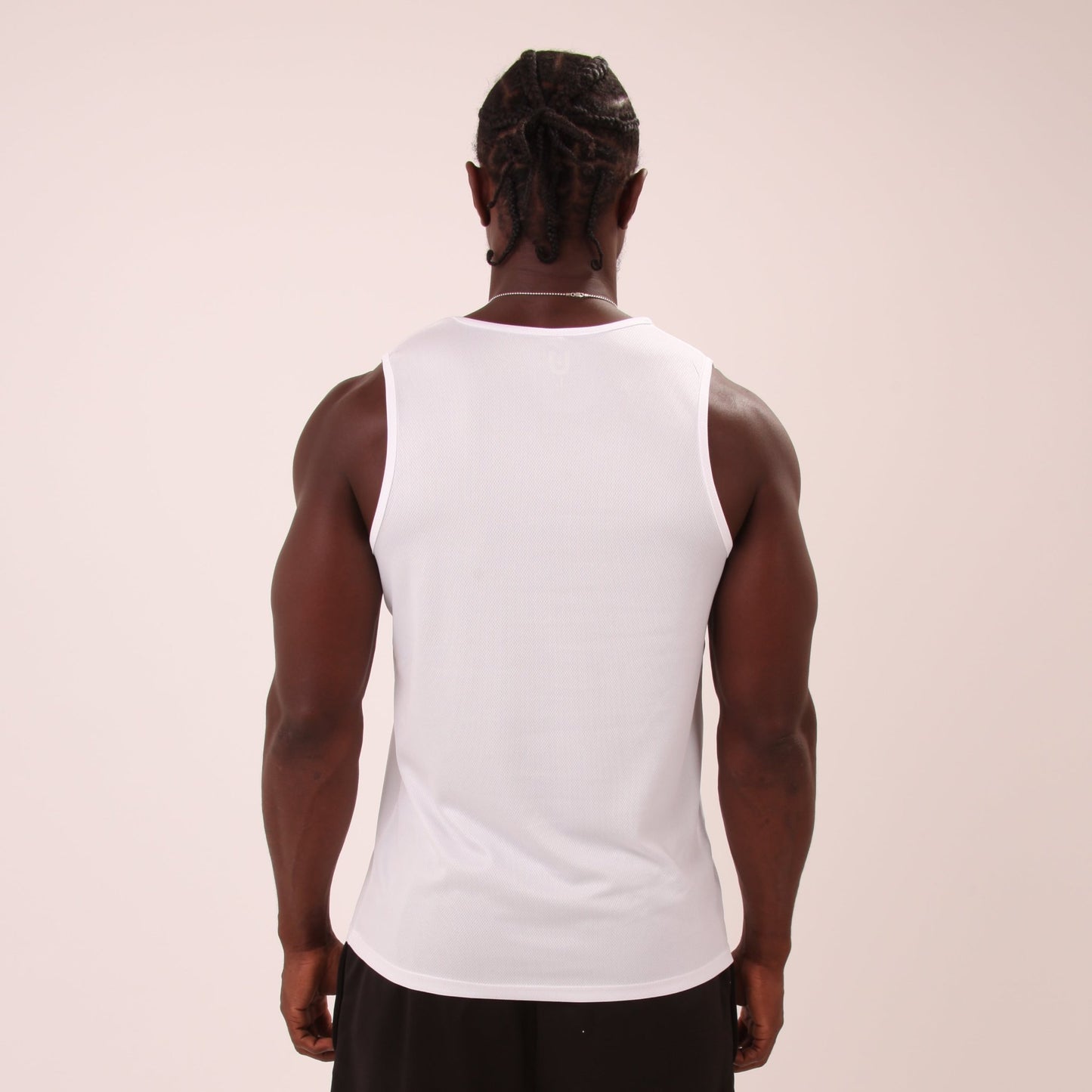 "Men's athletic white vest top by UNIFY, perfect for high-intensity workouts and casual wear."