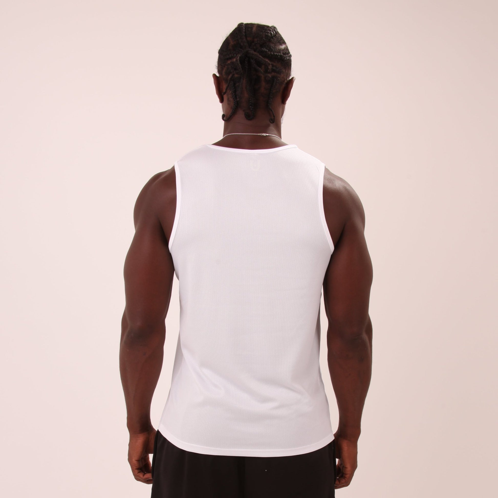 "Men's athletic white vest top by UNIFY, perfect for high-intensity workouts and casual wear."