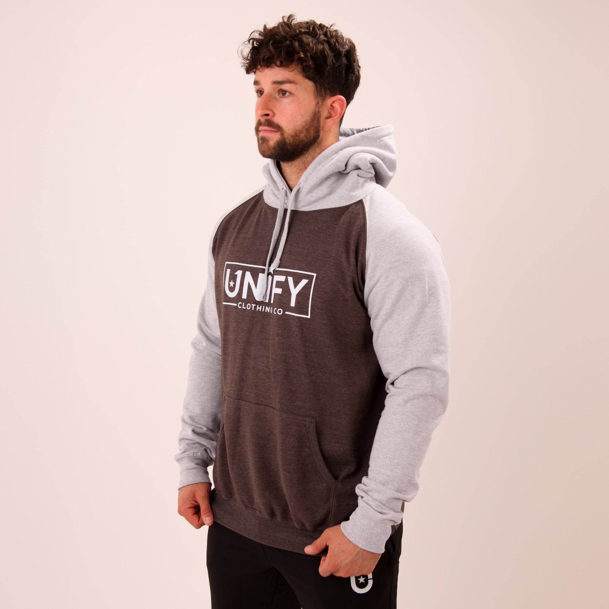 "Close-up of UNIFY's men's grey hoodie, highlighting the soft texture and durable material."