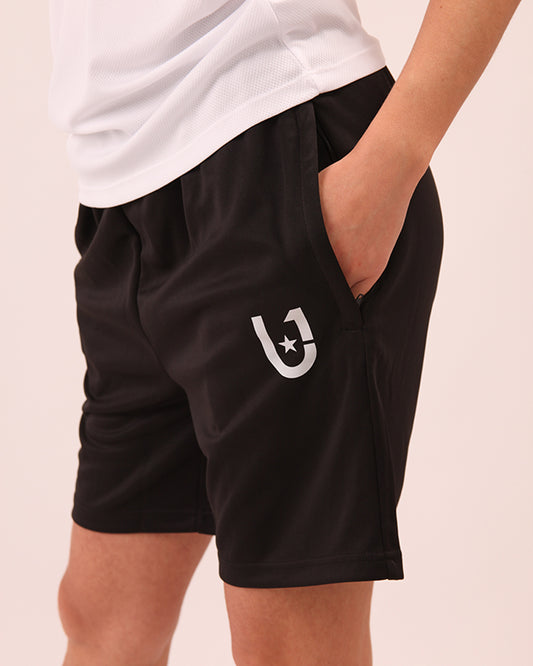 Side angle of UNIFY women’s shorts in black for athletic wear