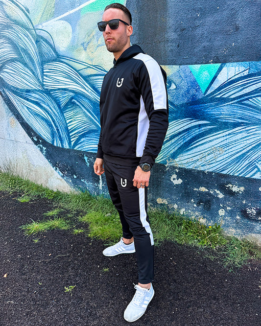 Front view of UNIFY black and white crossover men's tracksuit