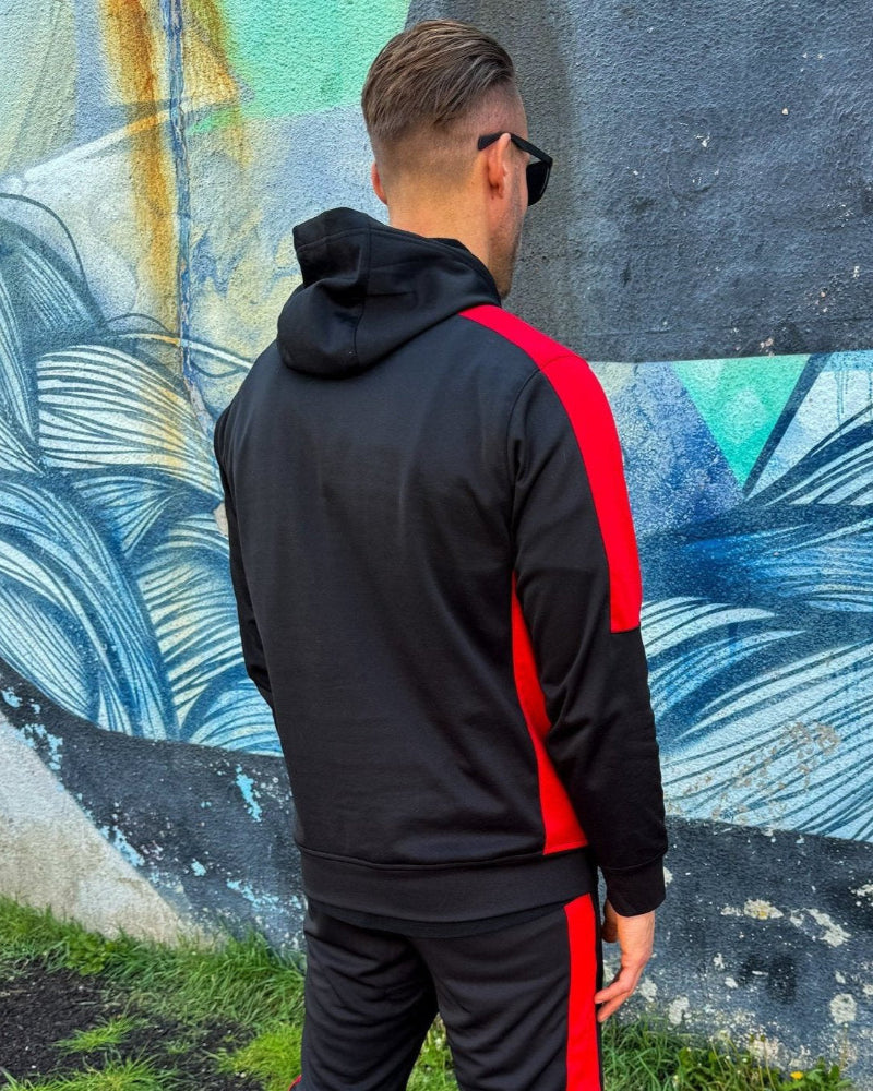 Action image of a man jogging in UNIFY Men's Crossover Track Pants, demonstrating fit and flexibility.