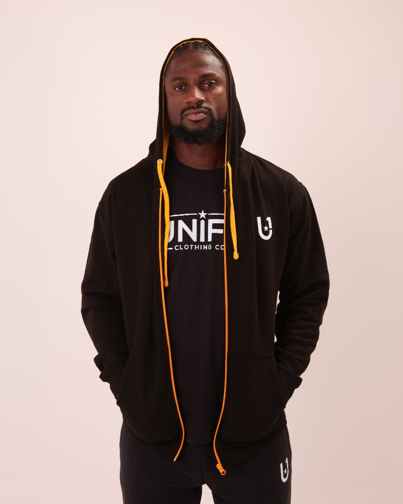 UNIFY men's black and yellow zippered hoodie featuring a vibrant contrast design, perfect for a stylish, sporty look.