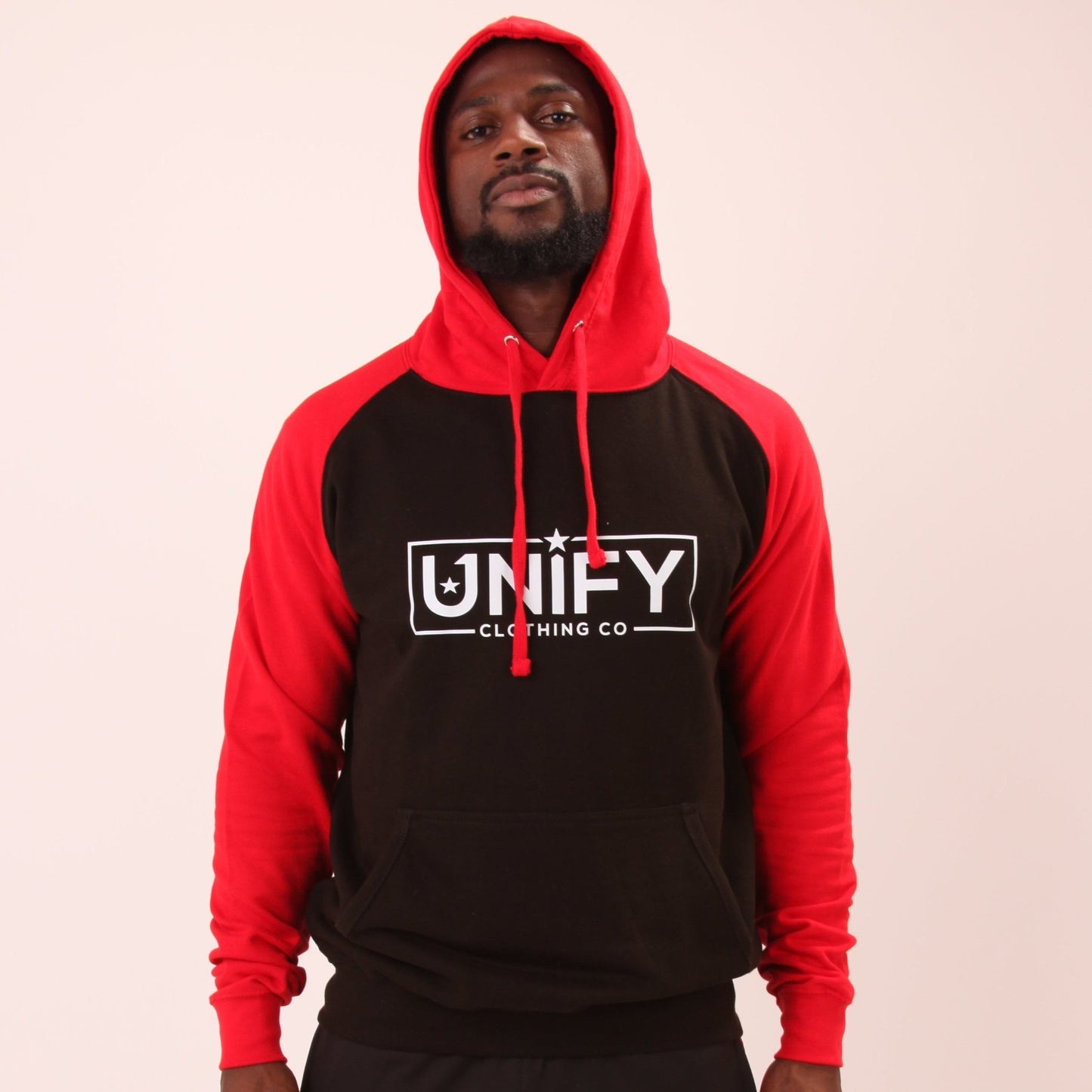 "UNIFY Men's Red/Black Essential Hoodie, perfect for a modern, active lifestyle with a fleece-lined interior for comfort."