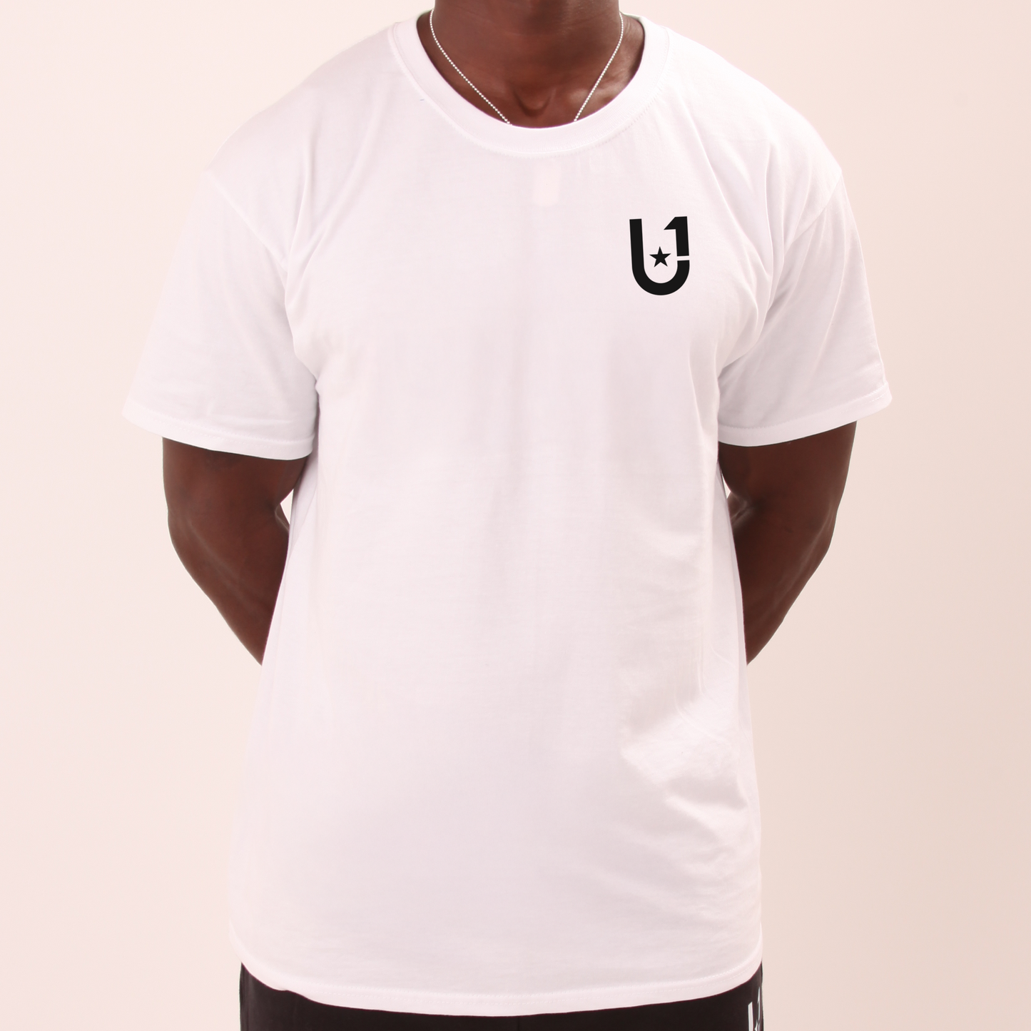 model wearing UNIFY men's white t-shirt with a clean, classic fit