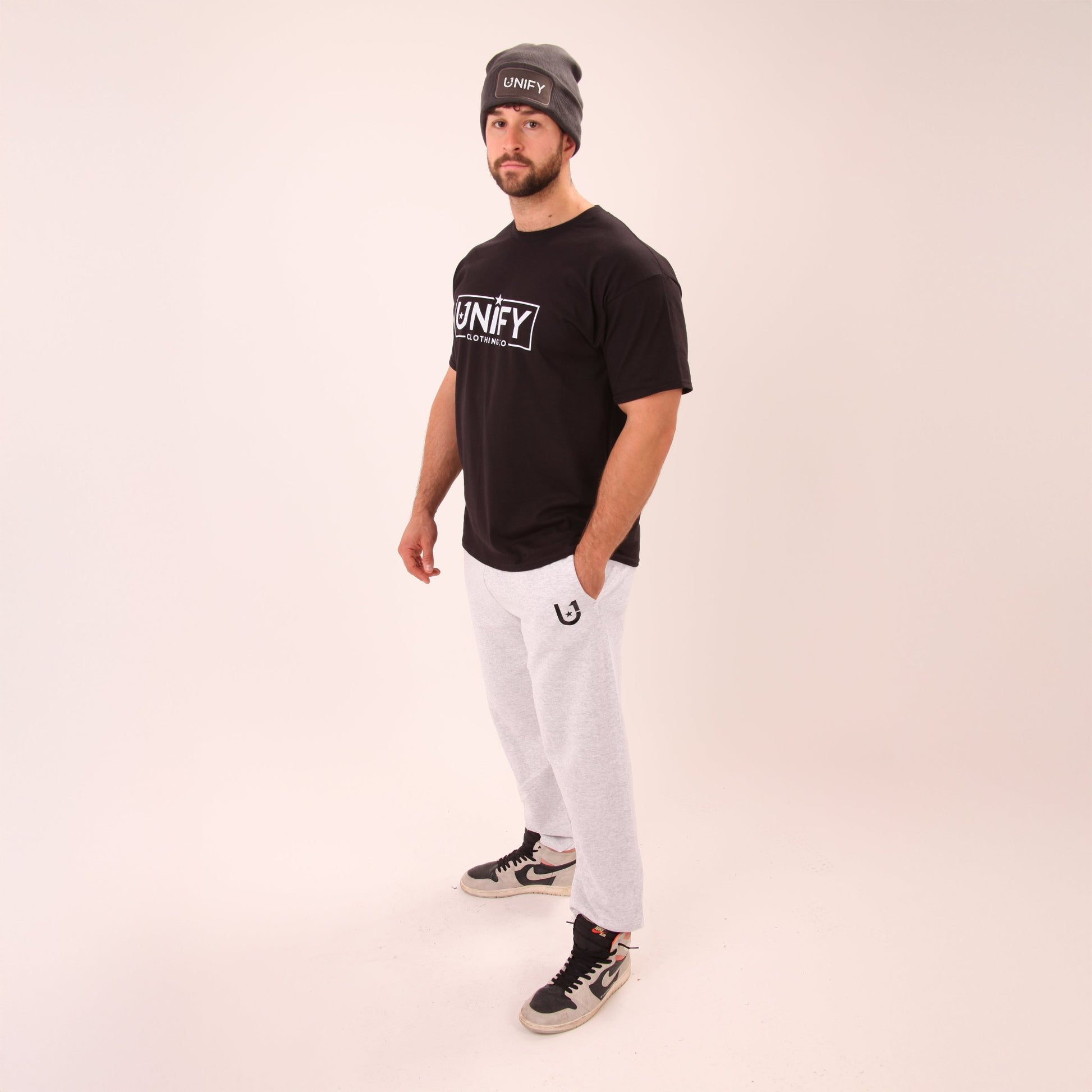 UNIFY's grey relaxed fit joggers displayed, highlighting their versatility and casual appeal.