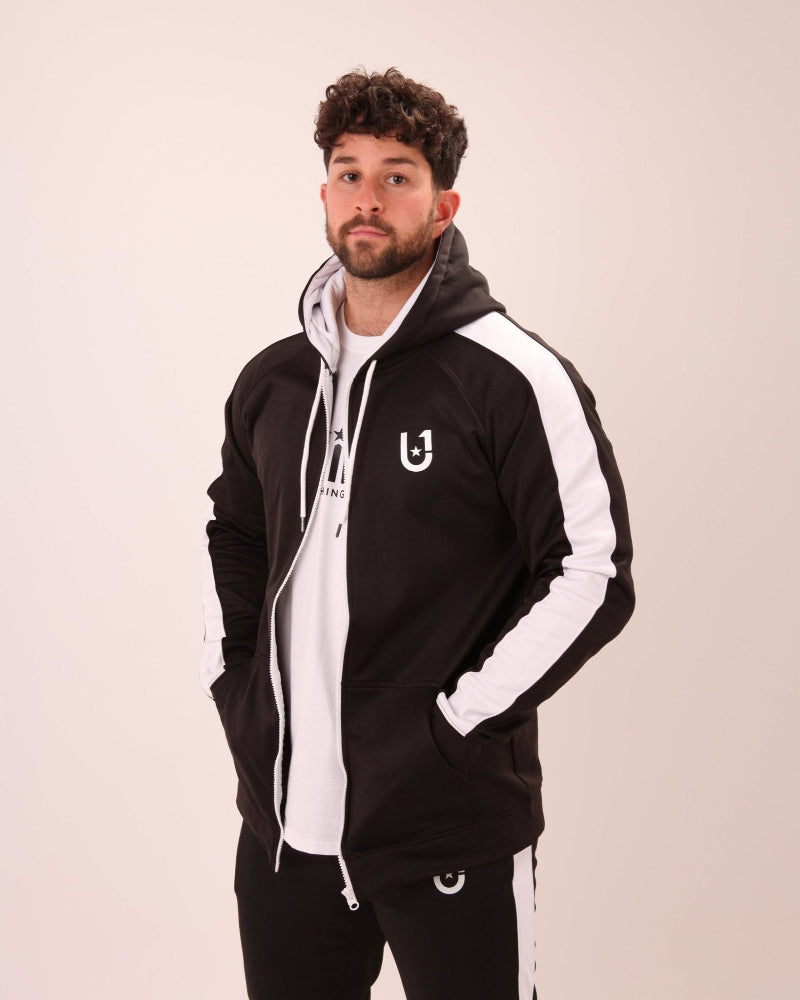 Close-up of UNIFY U1 black zip-up hoodie with a contrasting white stripe, designed for the modern man.