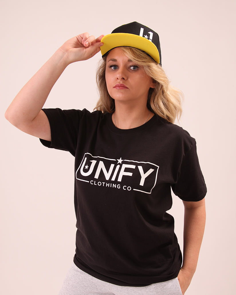 yellow hat by UNIFY worn by a woman, designed to unify and bring togetherness