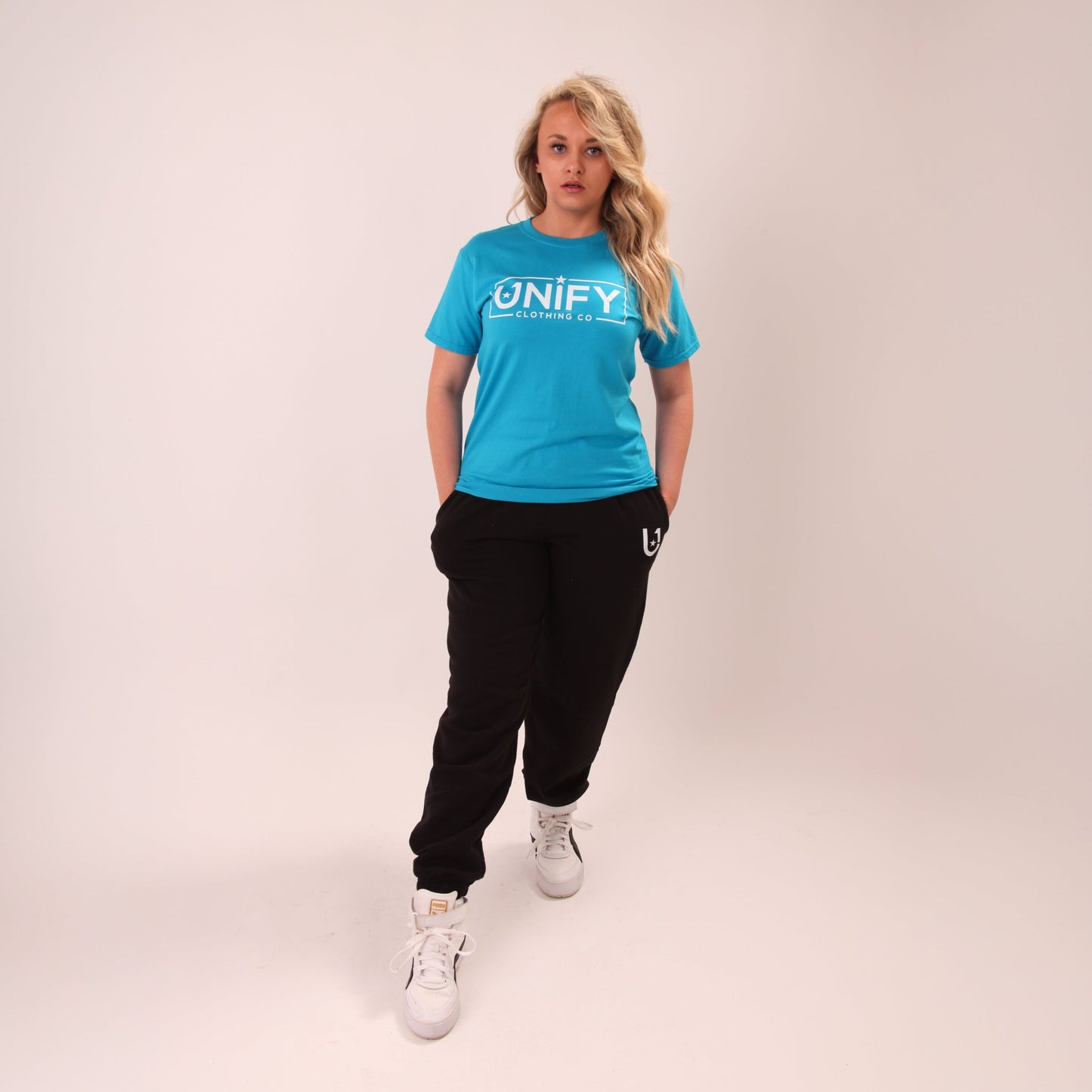 UNIFY women's black joggers in relaxed fit, perfect for a stylish, comfortable day.