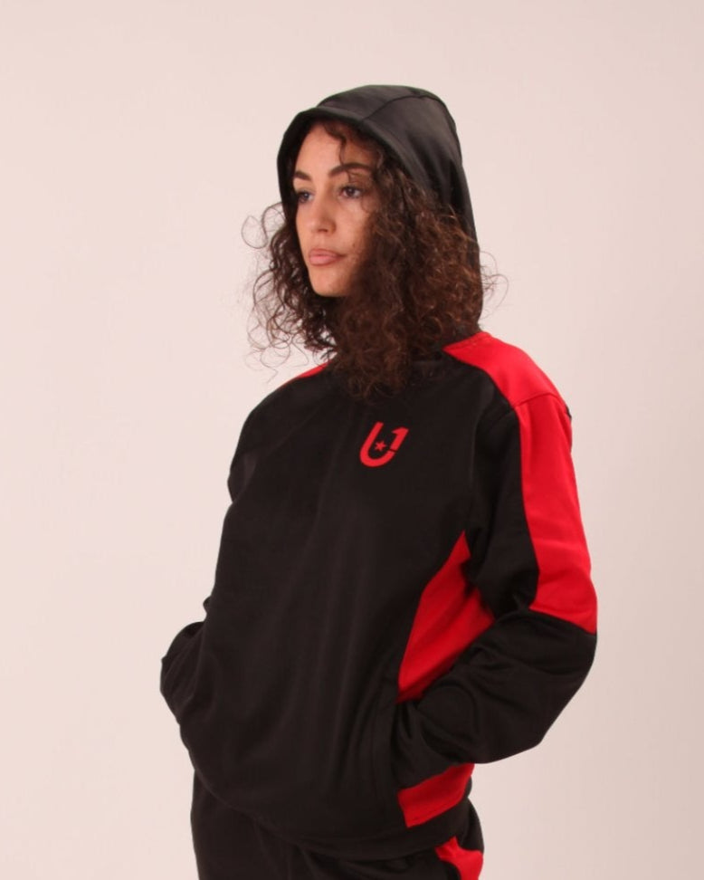 "UNIFY women's crossover track suit in black with striking red stripes, perfect for high-performance activities."