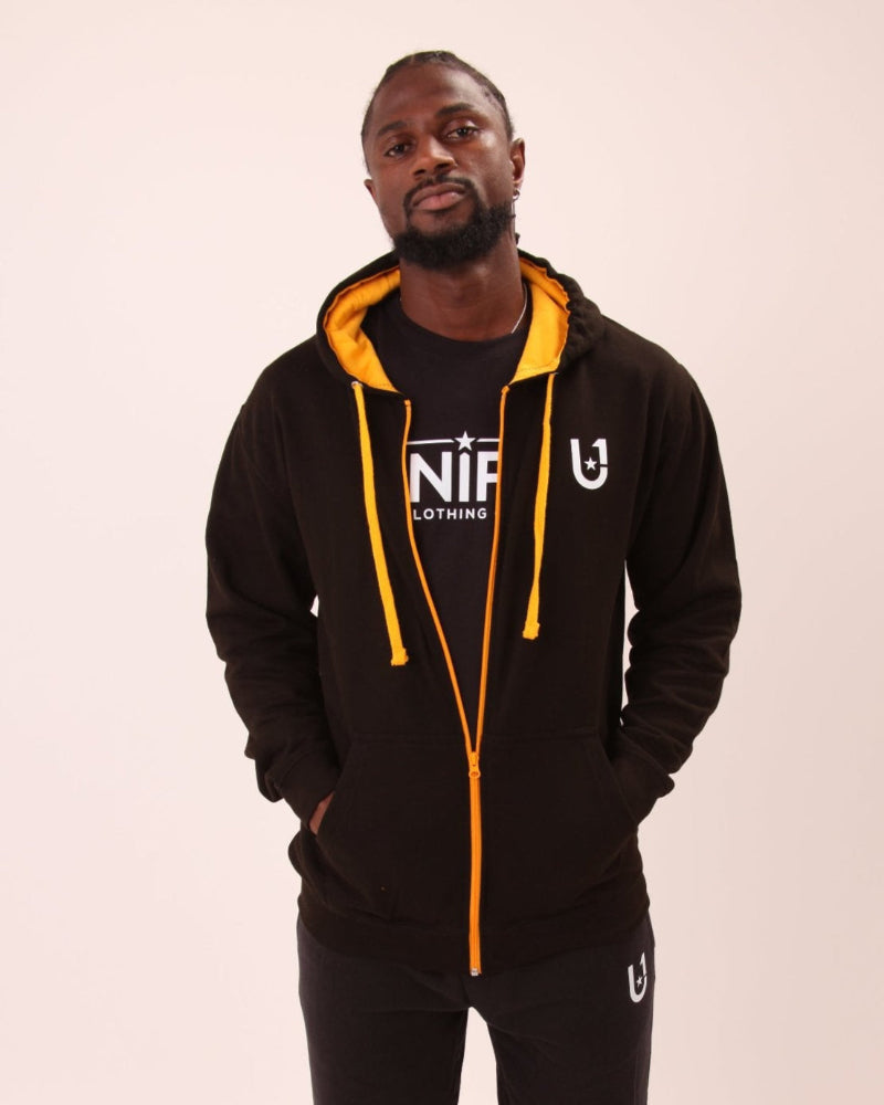 UNIFY's bold black and yellow zip hoodie on display, showcasing its trendy and functional appeal.