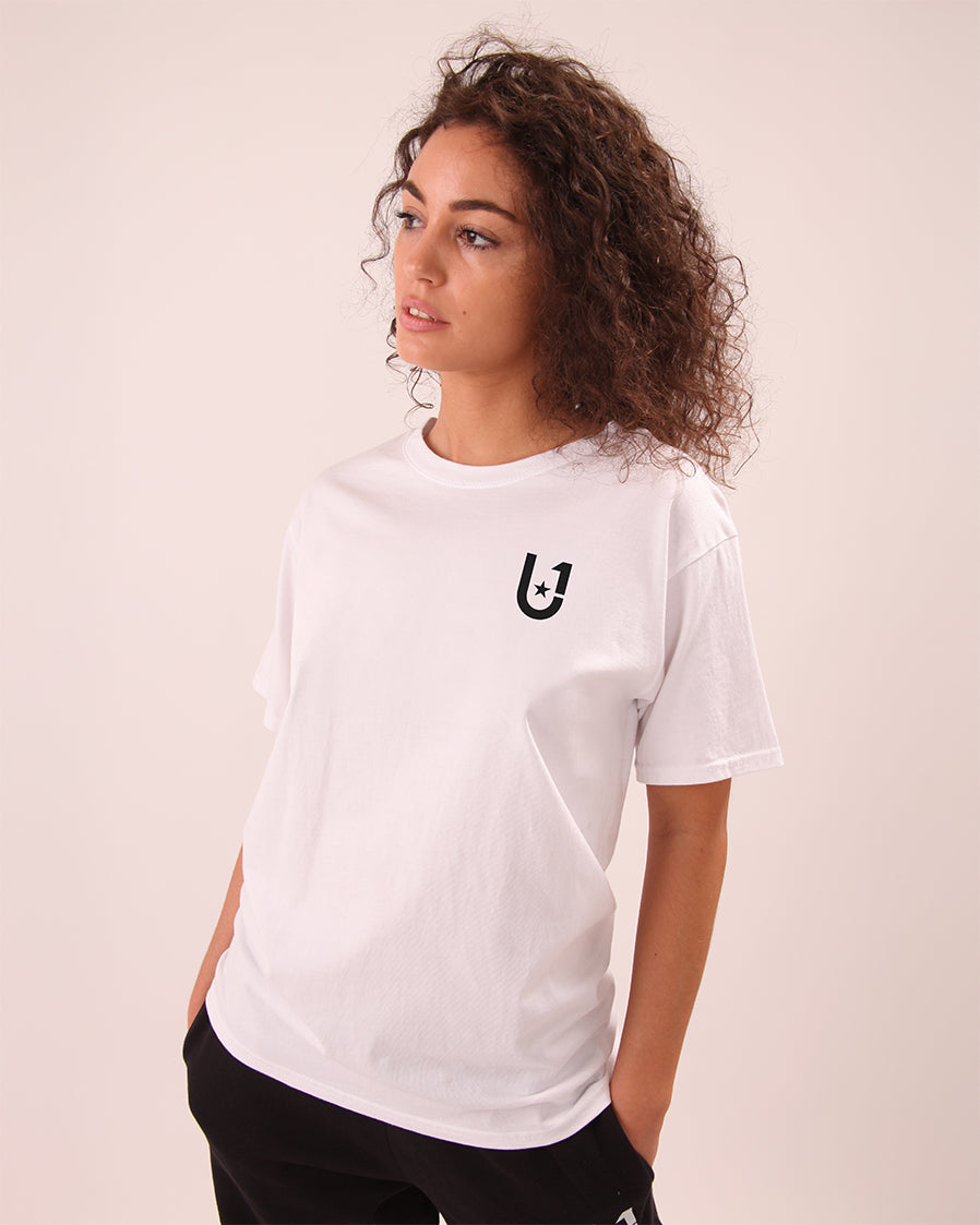 lifestyle shot of woman in UNIFY white t-shirt, perfect for casual and active wear