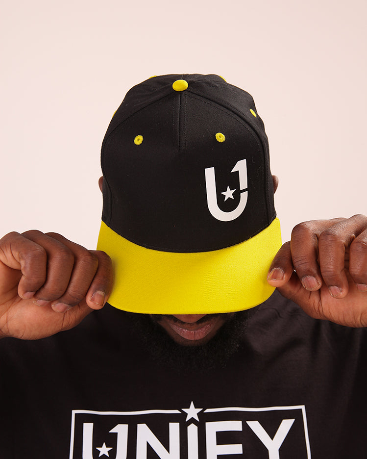 UNIFY Men's yellow baseball hat, perfect for beach days and outdoor sports.