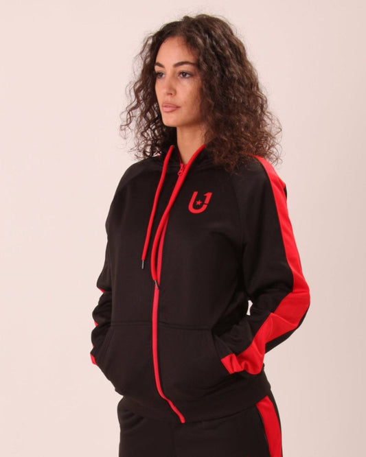 Woman wearing UNIFY's black and red hoodie, showcasing the chic contrast and zippered convenience.
