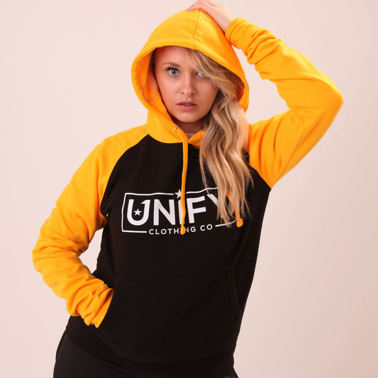 "UNIFY Women's Essential Hoodie in a striking yellow, perfect for adding vibrancy to your casual outfits."
