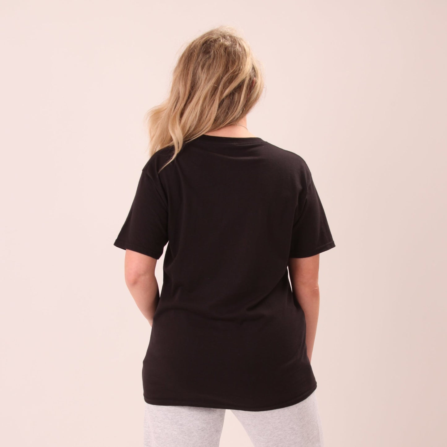 "Versatile black t-shirt for women, designed for both comfort and style, displayed on a white background."
