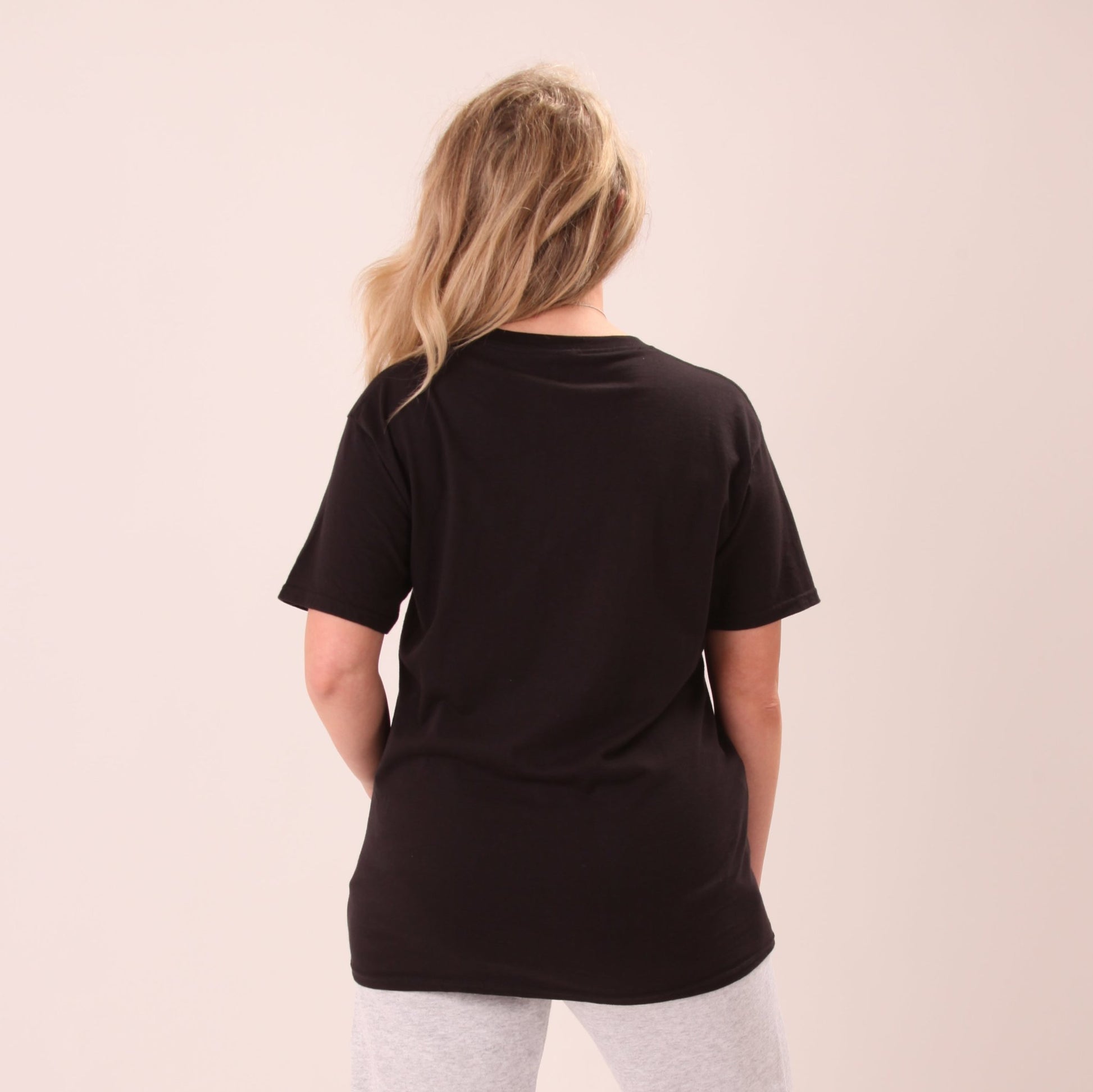"Versatile black t-shirt for women, designed for both comfort and style, displayed on a white background."
