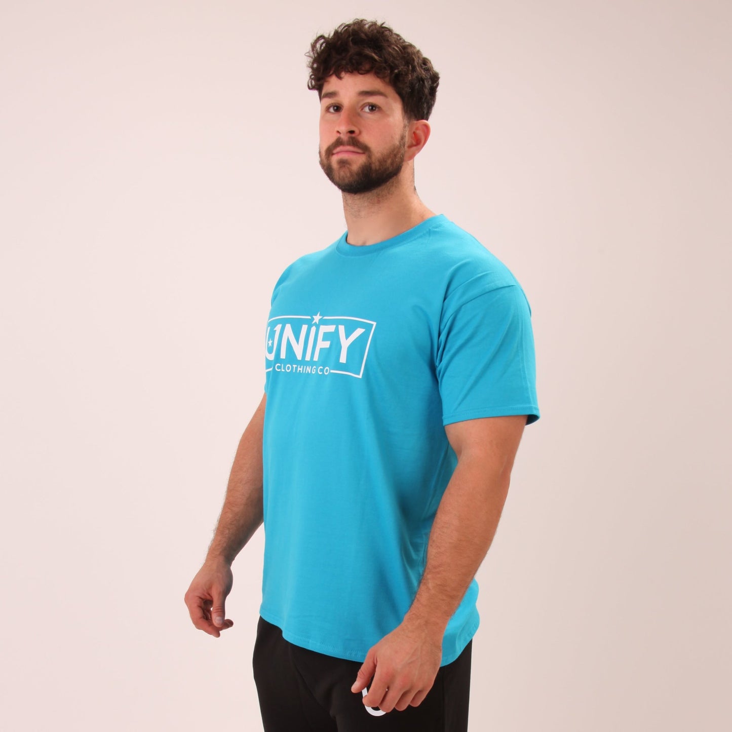 "Classic blue tee for men by UNIFY, perfect for daily wear and easy to pair."
