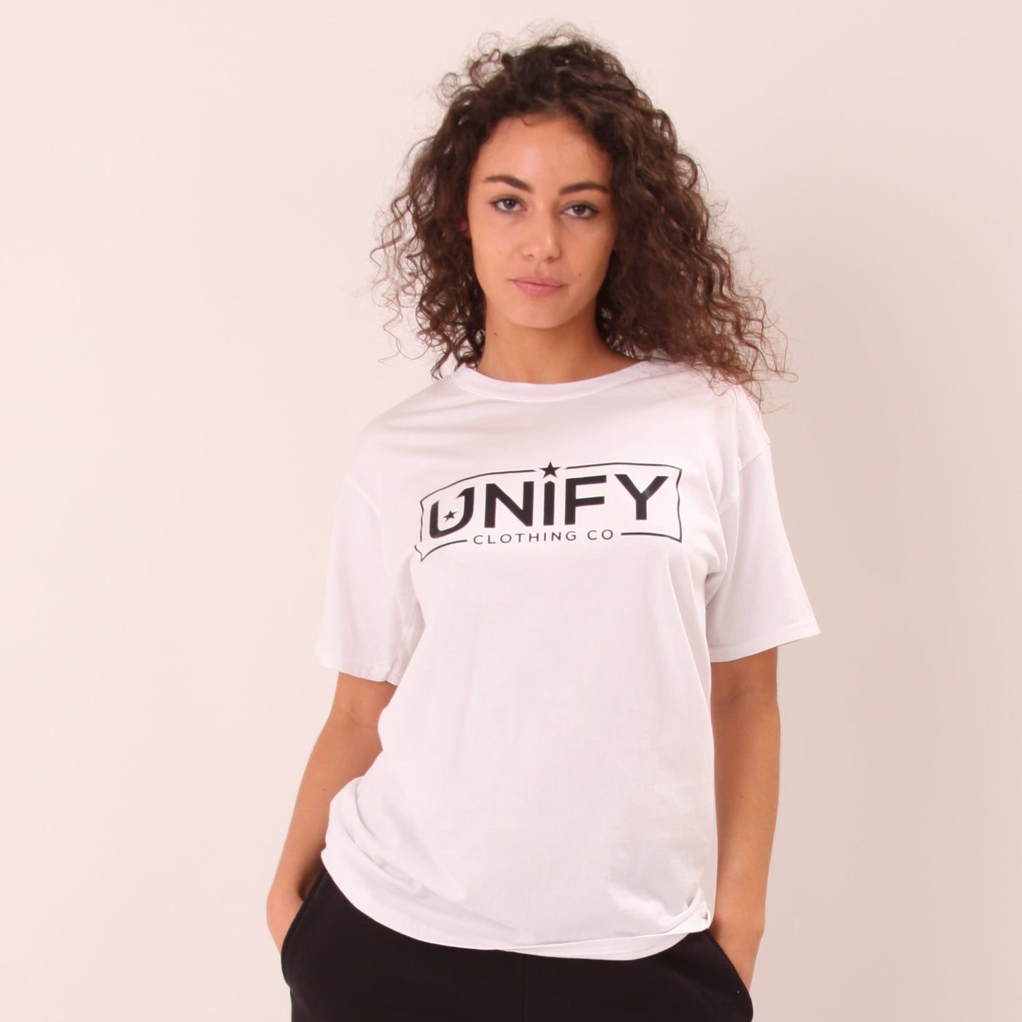 "Soft white t-shirt for women by UNIFY, ideal for versatile styling and everyday wear."
