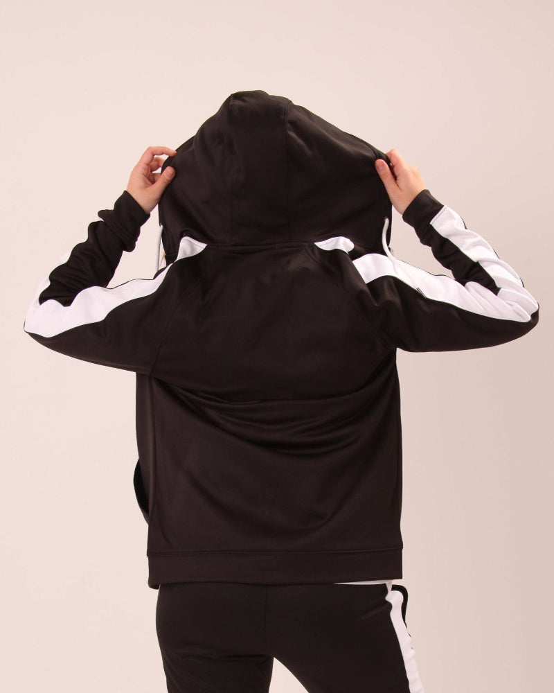 "Fashionable black and white striped zip-up hoodie for women, highlighting its sleek design."
