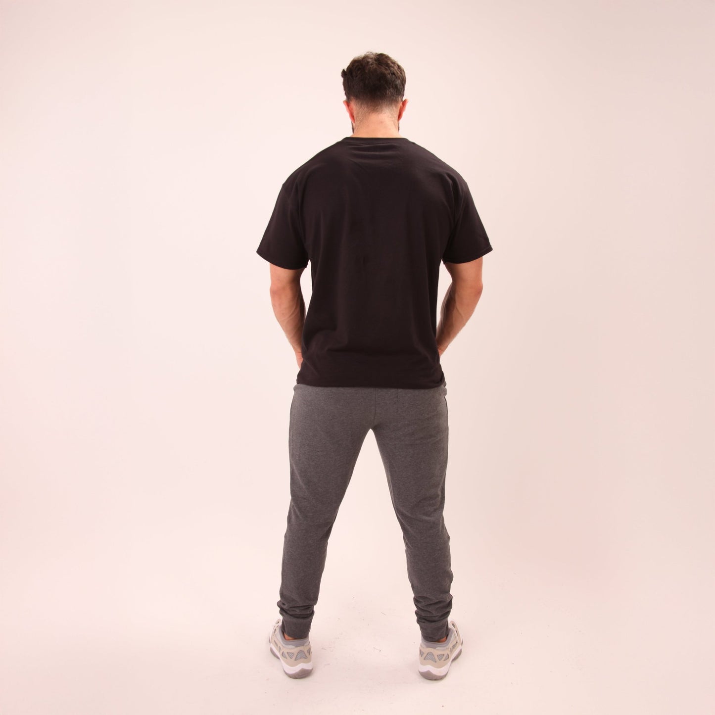 Casual look featuring UNIFY men's grey joggers, perfect for workouts or relaxed weekends.
