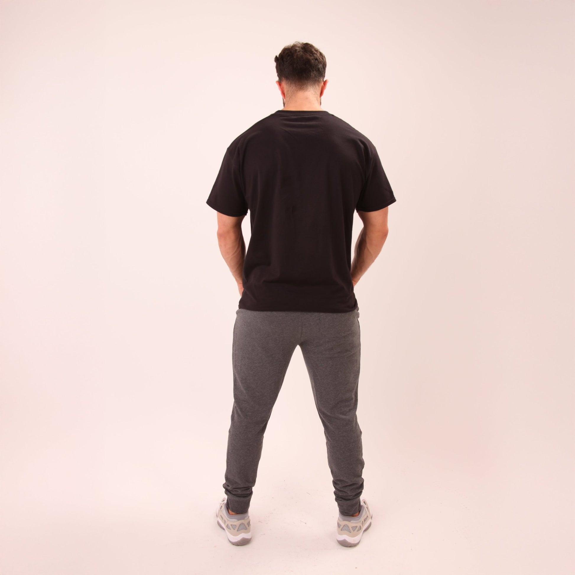 Casual look featuring UNIFY men's grey joggers, perfect for workouts or relaxed weekends.
