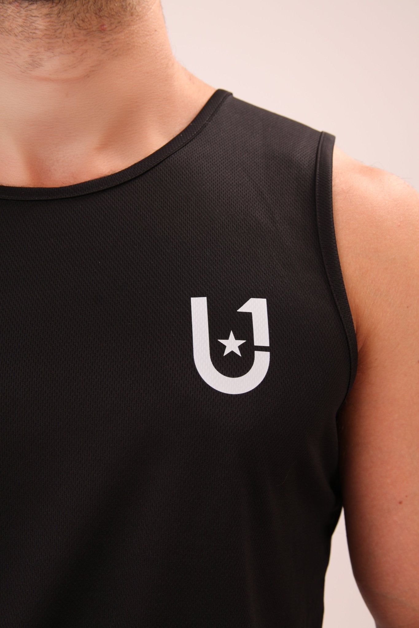 "UNIFY performance vest for men, designed for versatility in both active and leisure settings."
