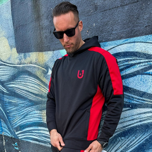 "Casual styling of UNIFY men's track pants with red stripes, paired with sneakers and a casual tee."
