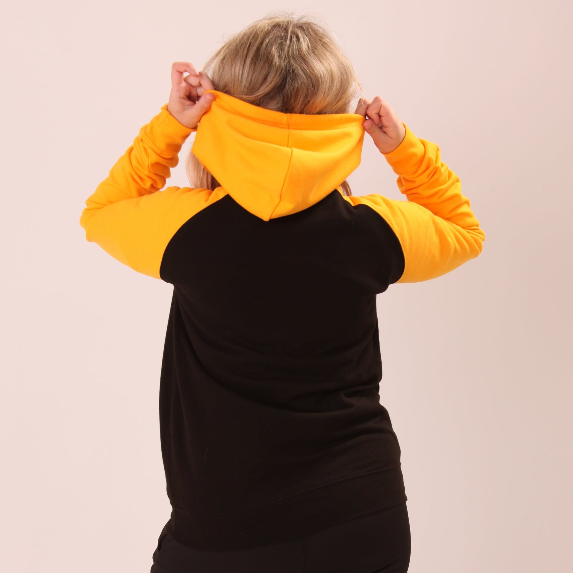 "Bright yellow women's hoodie from UNIFY, ideal for those who love a splash of colour in their wardrobe."
