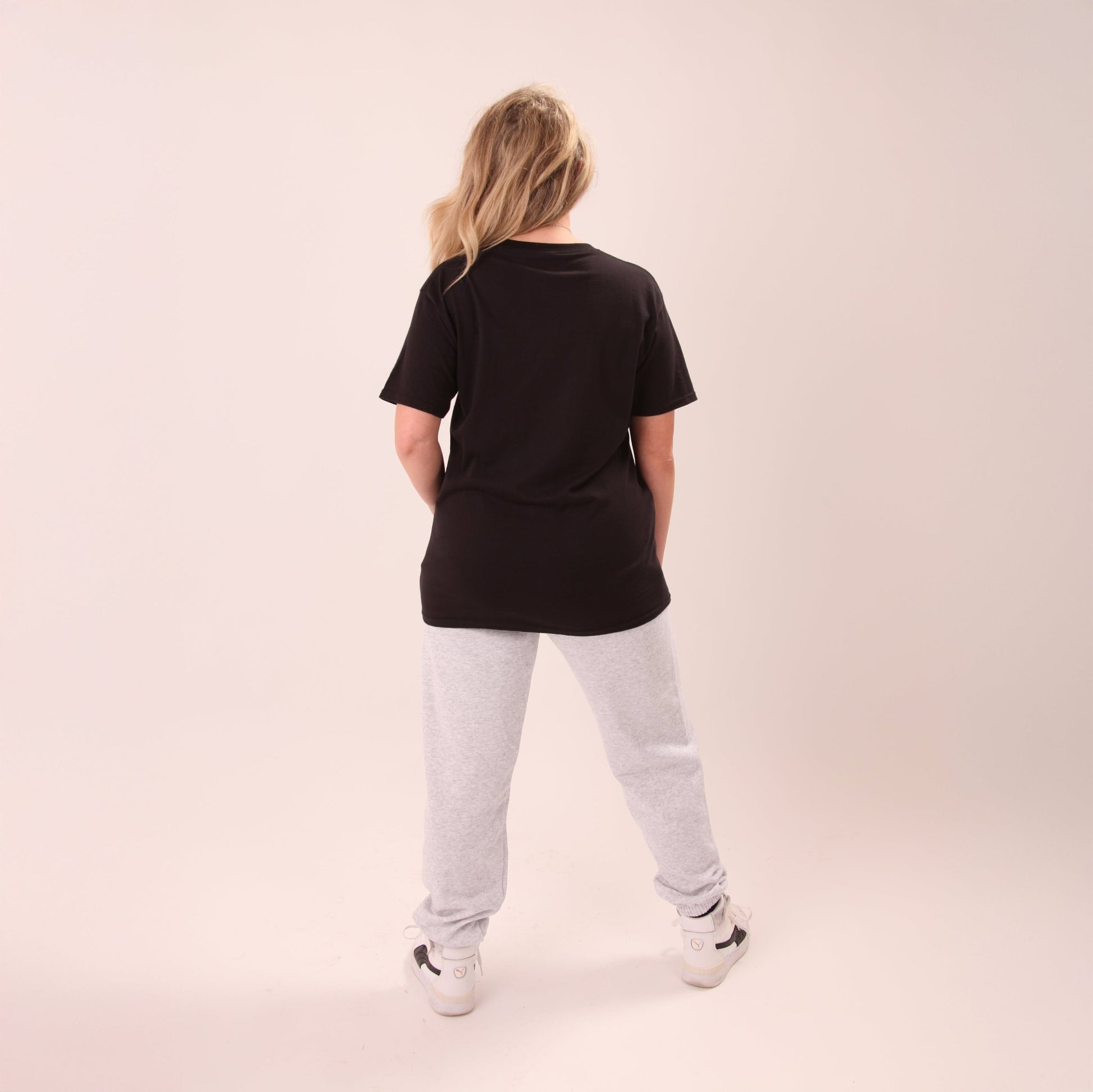 Display of UNIFY's grey wide-leg joggers for women, showcasing a chic and versatile wardrobe essential.
