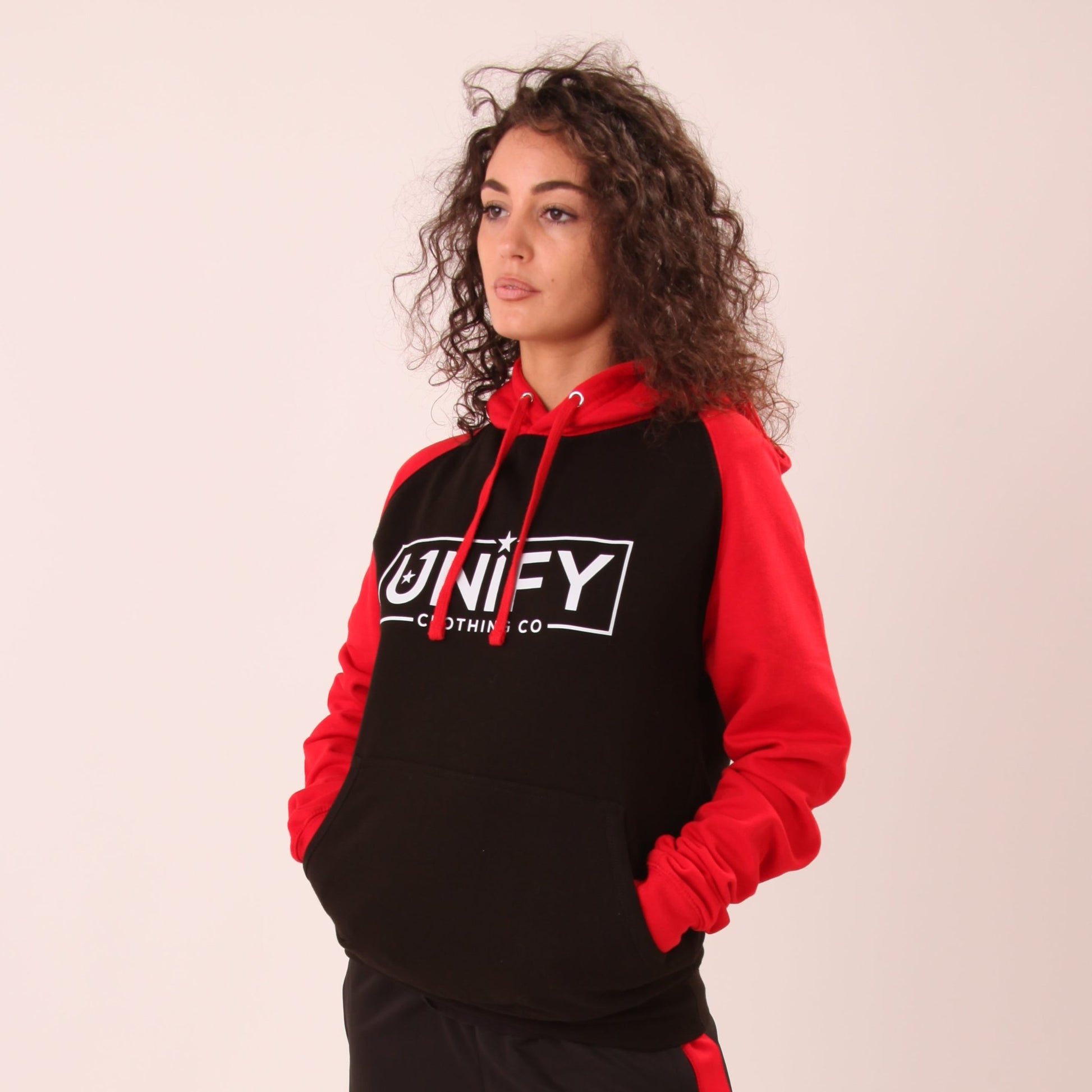 "Close-up of UNIFY's cozy women's essential hoodie, highlighting the soft fabric and snug fit."
