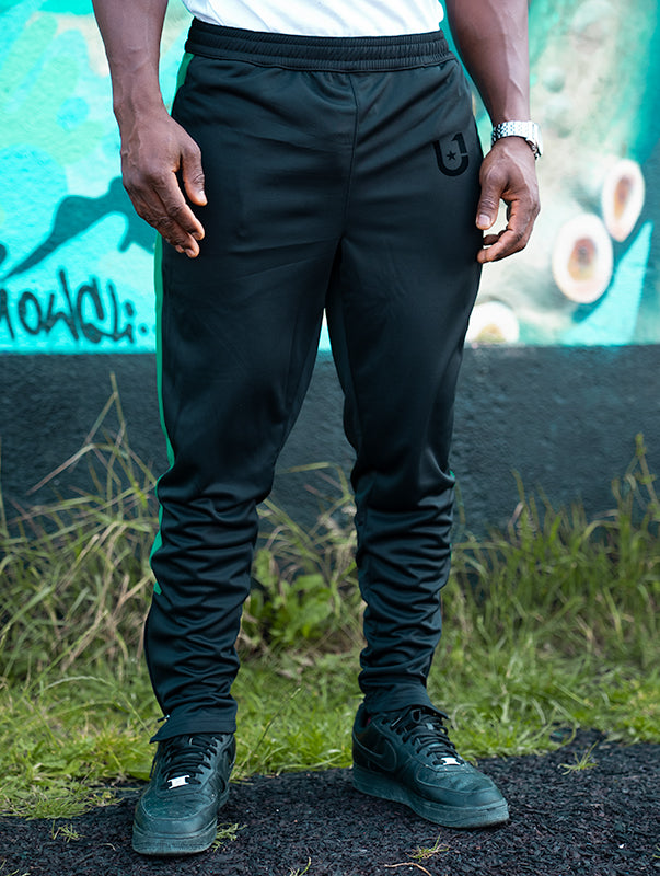 UNIFY crossover pants in black and green styled casually