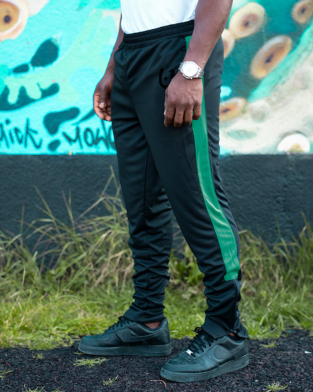 Urban black track pants with green stripe for a modern look