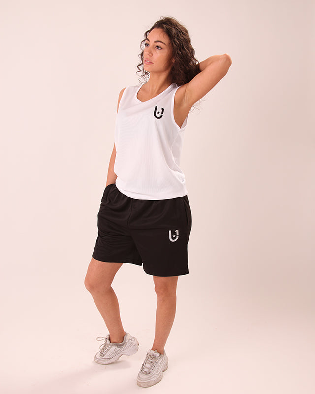 Front view of UNIFY black women’s shorts showing sleek fit