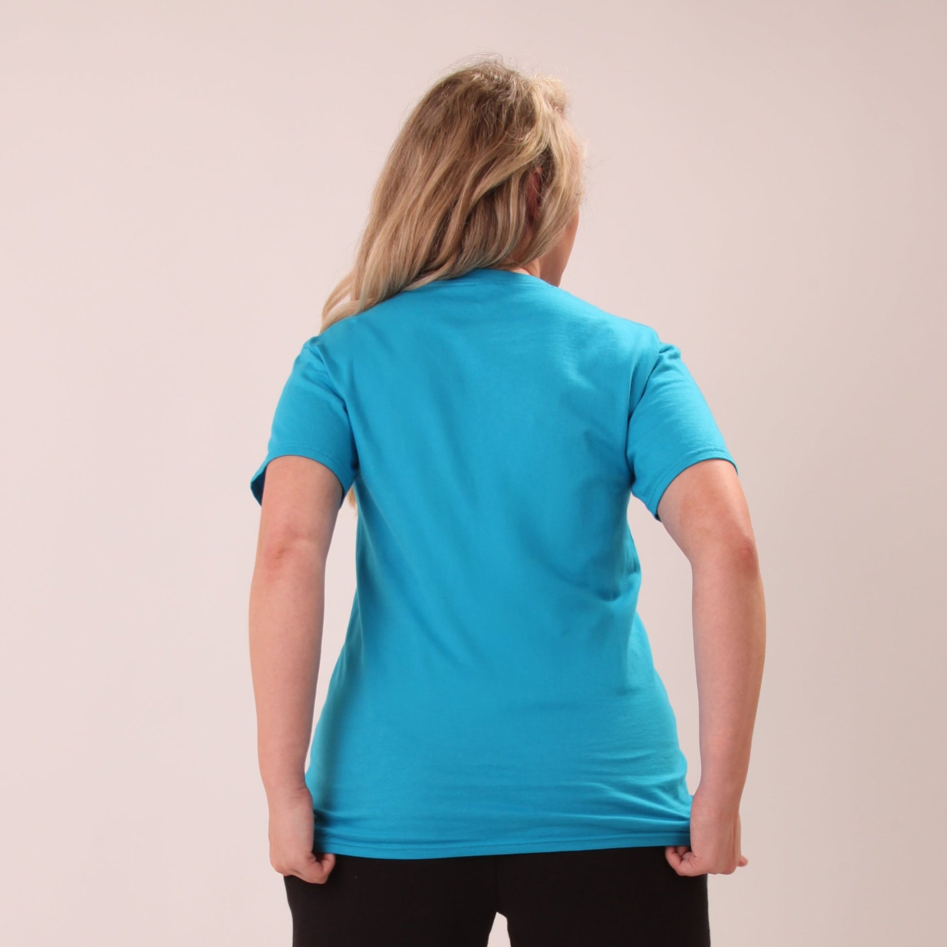 "UNIFY casual blue t-shirt for women, ideal for everyday wear, shown on a model."
