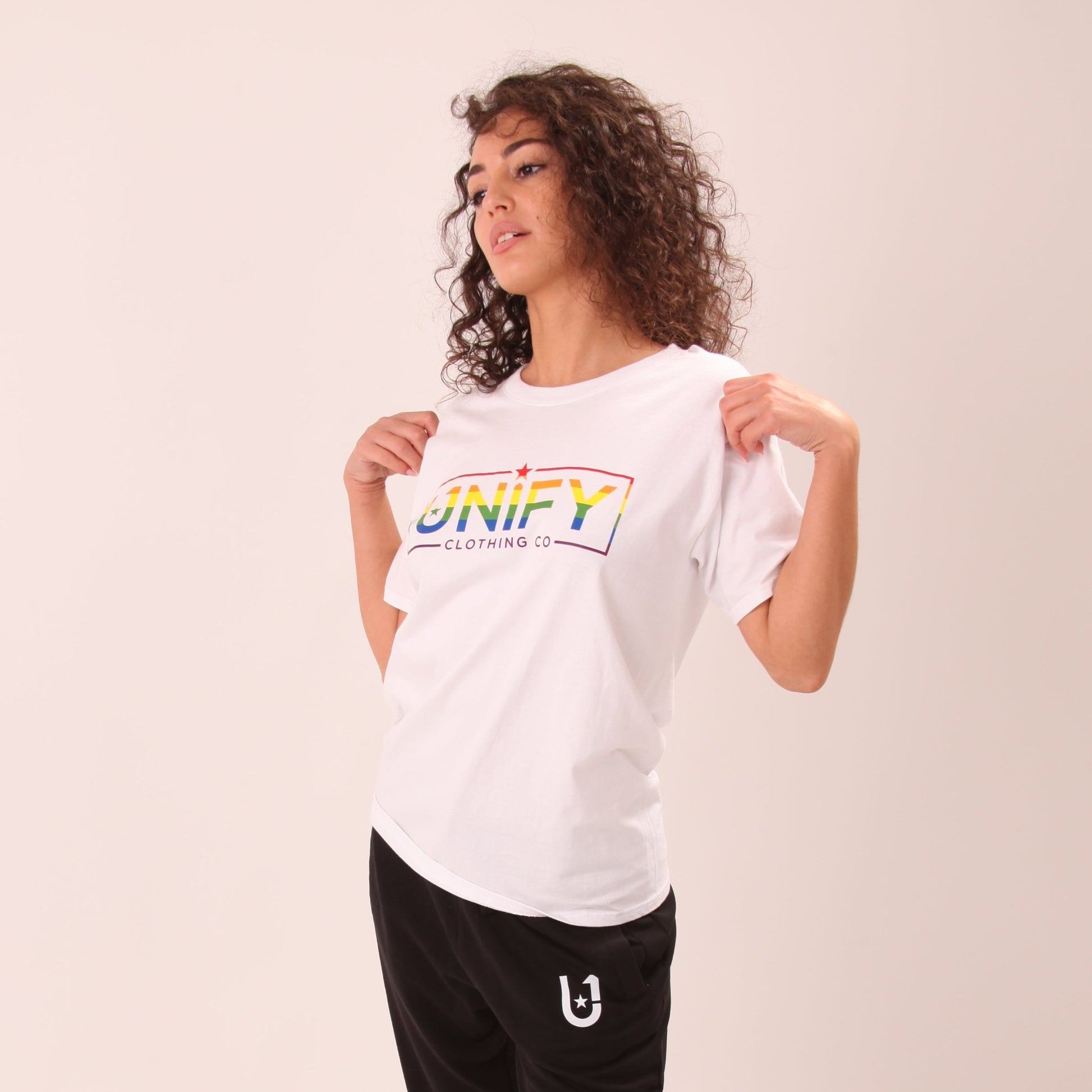 "Close-up of UNIFY 'Love is Love' women's t-shirt, emphasizing its powerful message and vivid colours."
