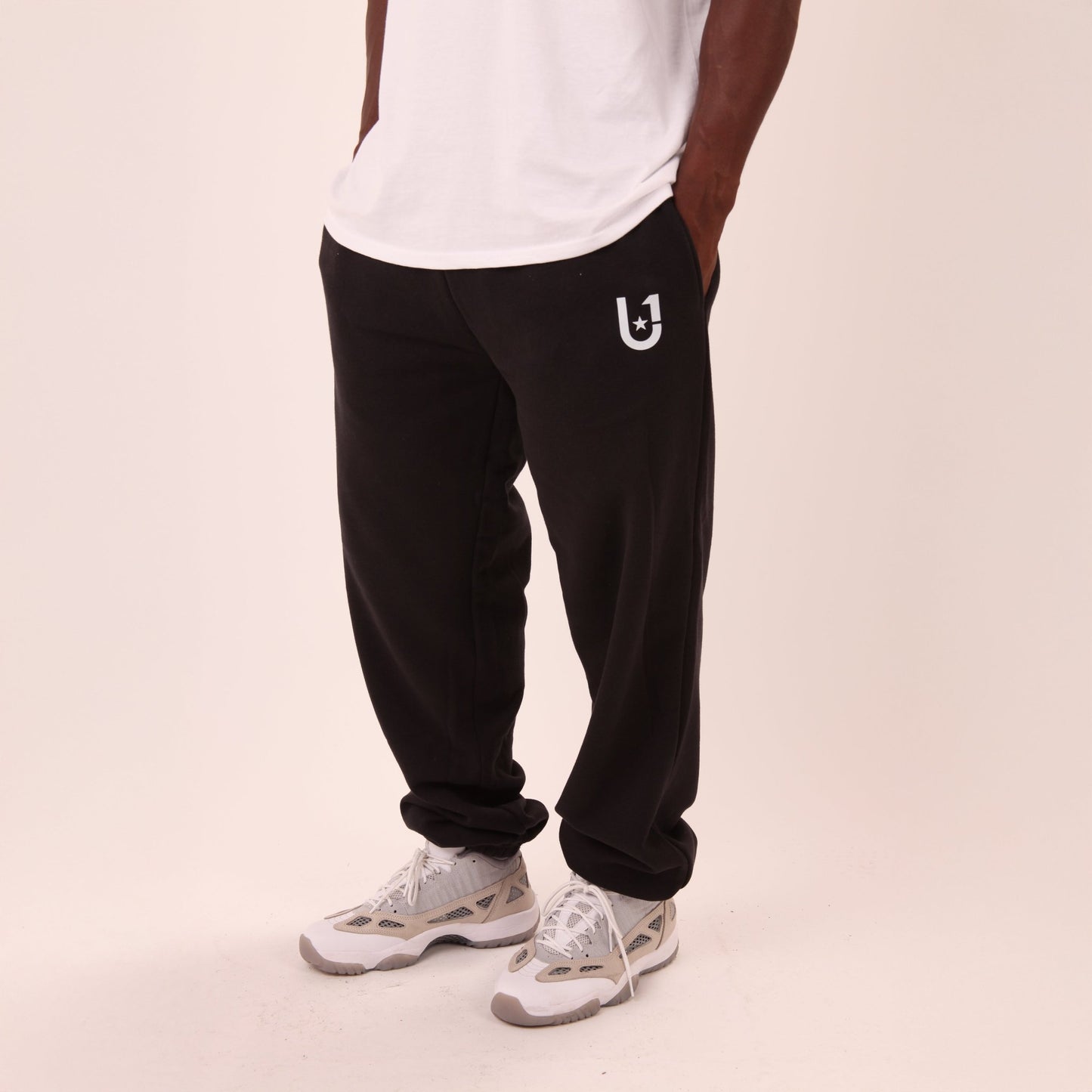 UNIFY men's black joggers in a relaxed fit, perfect for lounge days or casual outings.