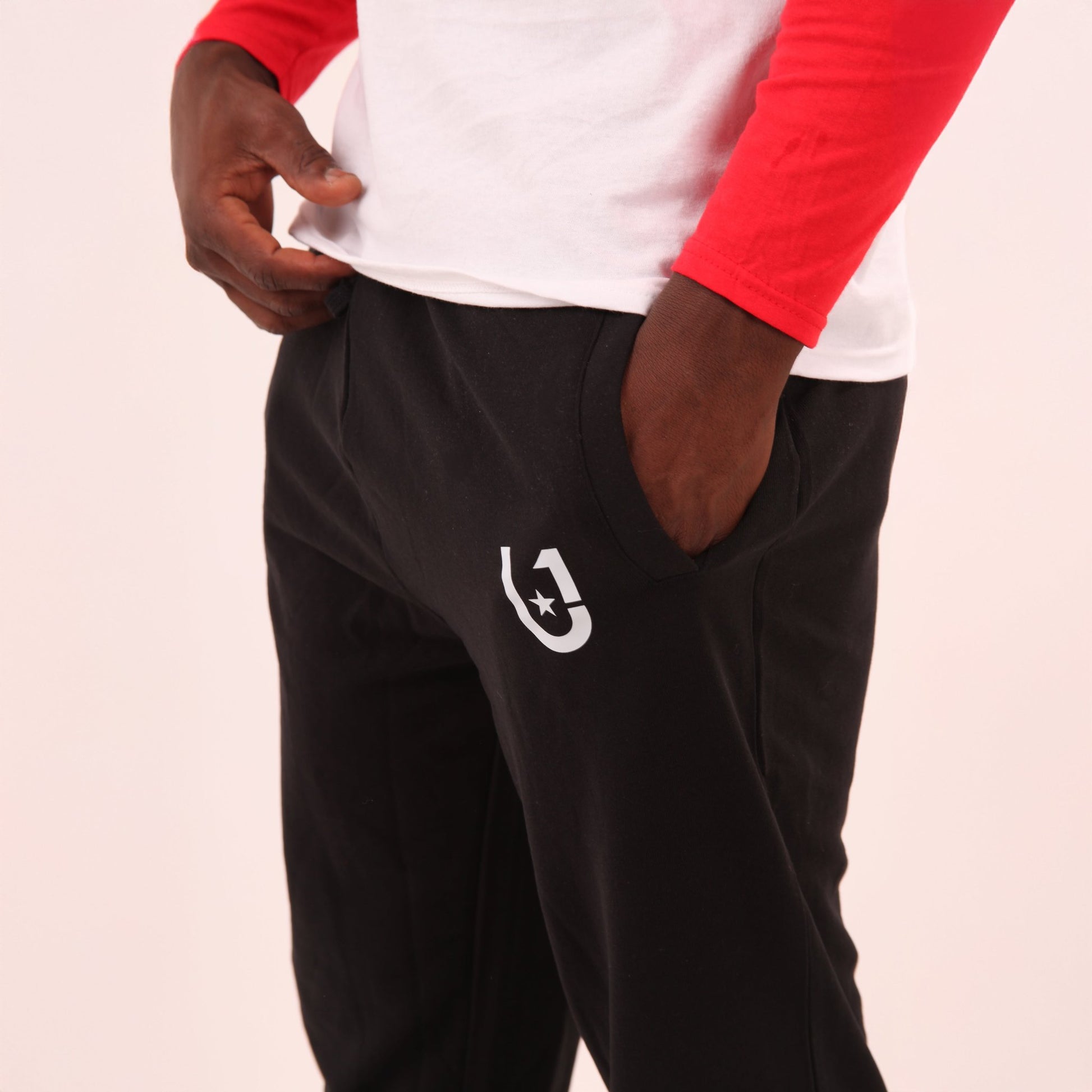 "Man wearing UNIFY Men's lounge sweat pants, ideal for a relaxed day at home or casual outings."
