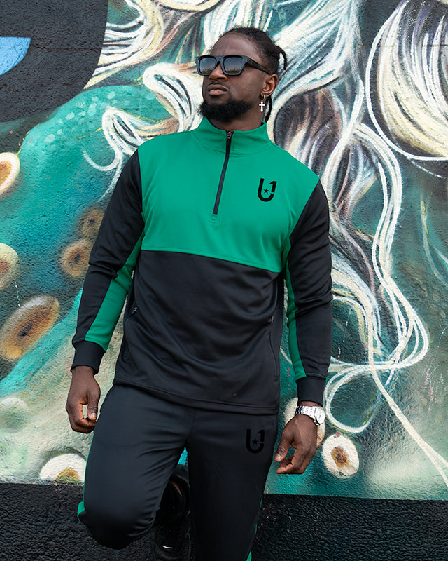 Front view of UNIFY Motion Line green and black track top