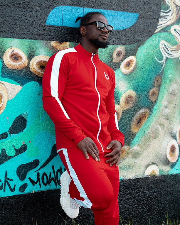Side profile of red and white track top highlighting athletic fit