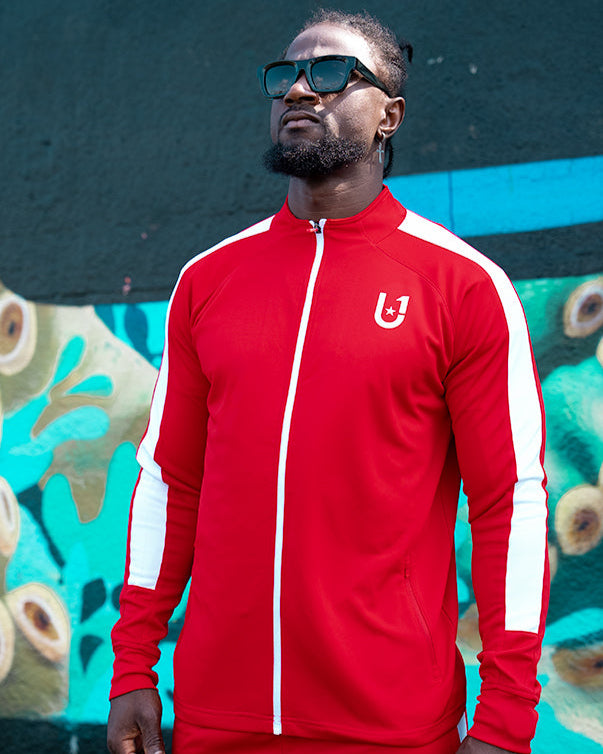 Front view of UNIFY red and white track top showcasing bold design