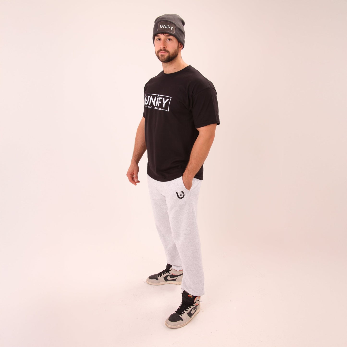 UNIFY's grey relaxed fit joggers displayed, highlighting their versatility and casual appeal.
